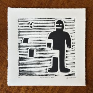 a humanoid figure in black ink